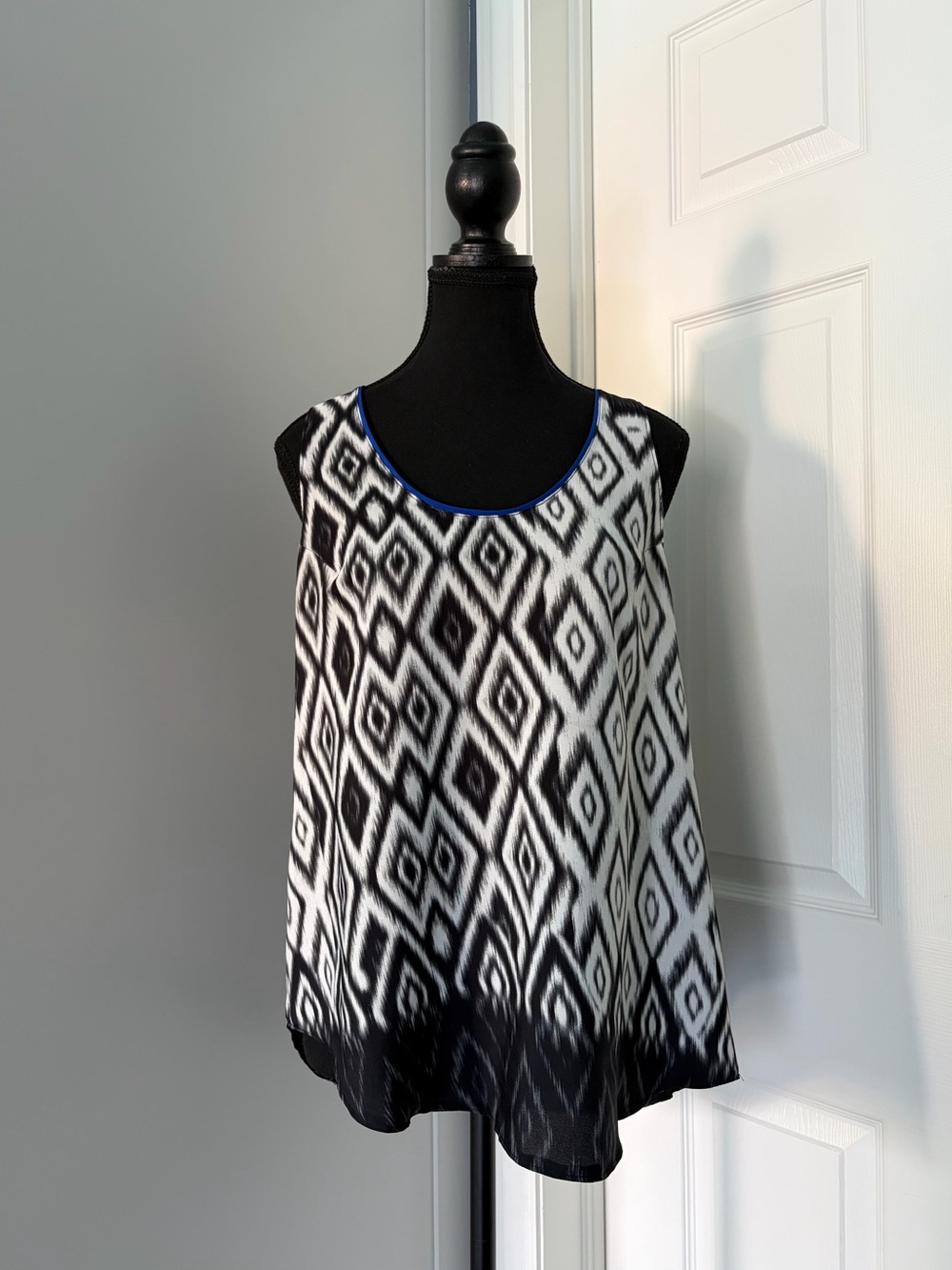 Black and White Ikat Print Sleeveless Blouse with Royal Blue Trim